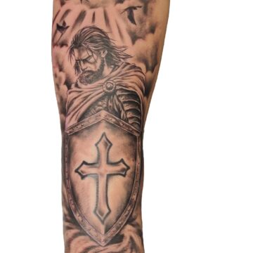 Black and grey warrior and cross shield forearm sleeve tattoo – Primitive Tattoo Perth