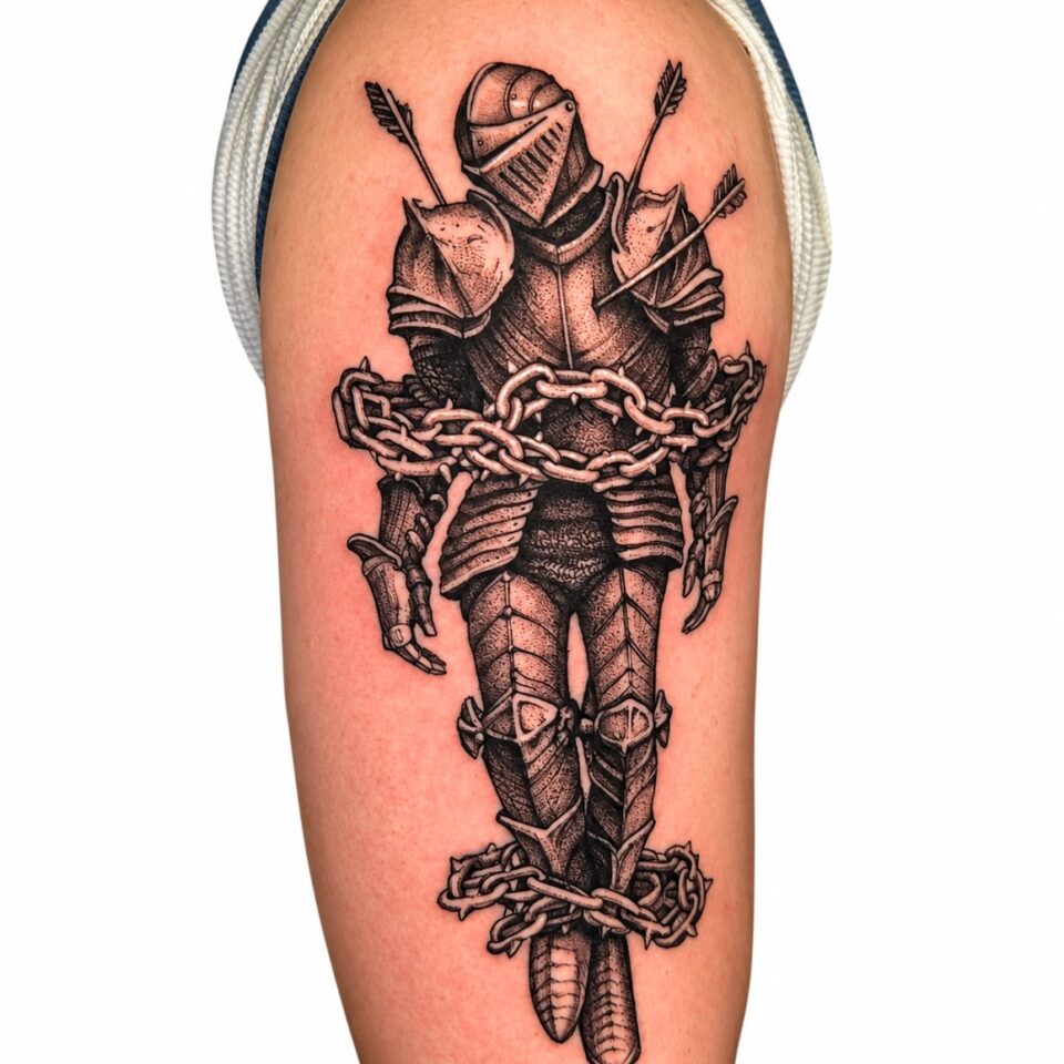 Black and grey armoured knight upper arm tattoo by Artem, Primitive Tattoo Perth