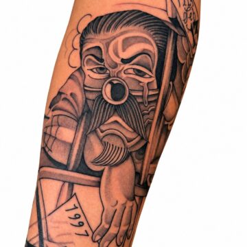 Black and grey warrior portrait forearm tattoo – Primitive Tattoo Perth