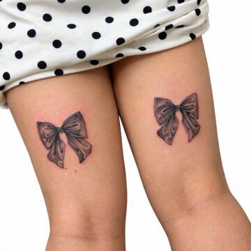 Matching black and grey bow tattoos on the back of the thighs – Primitive Tattoo Perth