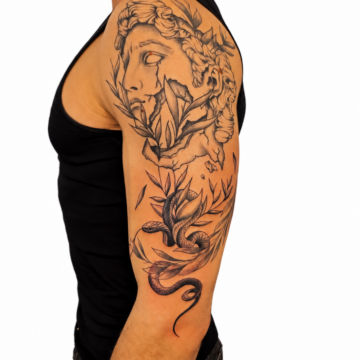 Black and grey statue and floral half sleeve tattoo Perth