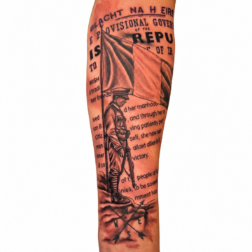 Black and grey soldier and newspaper forearm sleeve tattoo Perth